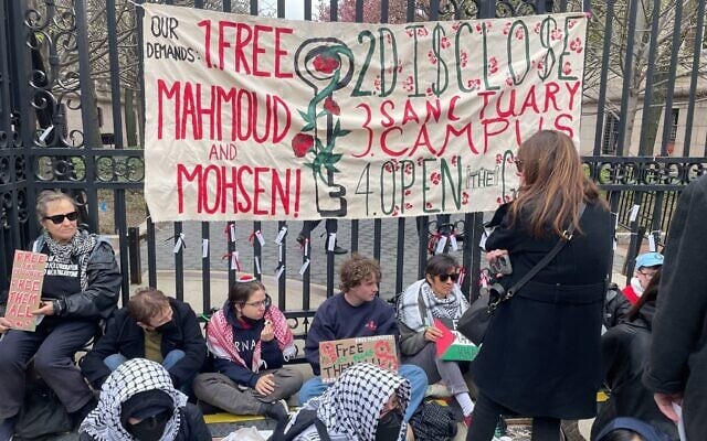Anti-Israel protesters at a gate to Columbia University, April 21, 2025. (Luke Tress/Times of Israel)