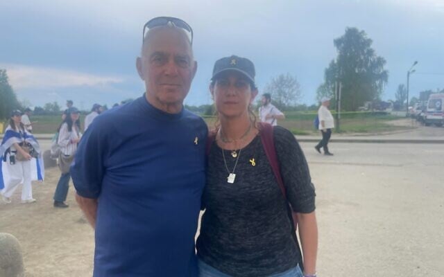 Freed hostage Gadi Mozes and his daughter Moran visit Auschwitz-Birkenau as part of the March of the Living on April 24, 2025. (Jessica Steinberg/The Times of Israel)