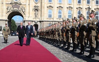 Hungary's Prime Minister Viktor Orban (L) and Prime Minister Benjamin Netanyahu are greeted by a military honor guard on April 3, 2025 in Budapest, Hungary. (Avi Ohayon / GPO)
