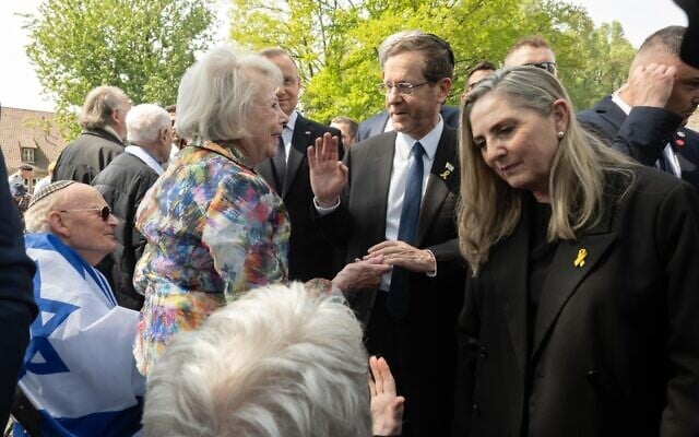 President Isaac Herzog greets Holocaust survivors and released hostages at the start of March of the Living on April 24, 2025. (Chen Schimmel/March of the Living)
