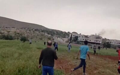 Palestinians react as Israeli settlers break into the West Bank village of Duma, where they set several houses on fire, on April 1, 2025. (Screencapture: X, used in accordance with Clause 27a of the Copyright Law)