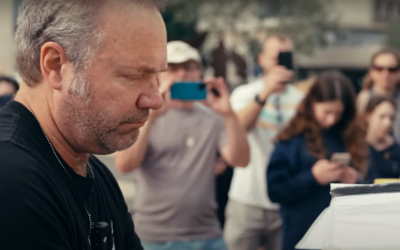 US singer-songwriter John Ondrasik, known by his stage name Five for Fighting, plays the piano that stands at Tel Aviv's Hostages Square, in a screen grab from the music video for the revamped version of his 2000 song 'Superman,' published April 14, 2025.