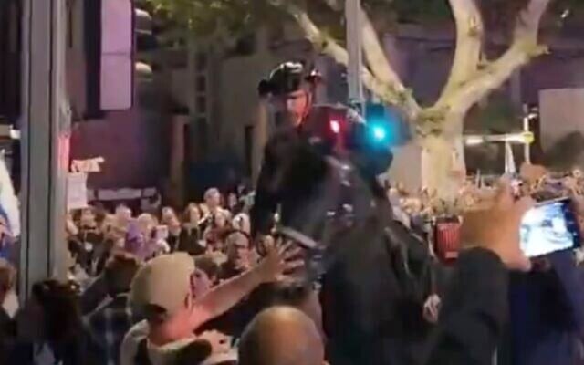 Mounted police officer appears to whip Haaretz photographer Itai Ron during anti-government protest in Tel Aviv on April 21, 2025. (Screen capture/X) Mounted police officer appears to whip Haaretz photographer Itai Ron during anti-government protest in Tel Aviv on April 21, 2025. (Screen capture/X)