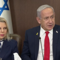Sara Netanyahu, left, and her husband Prime Minister Benjamin Netanyahu speak to slated Independence Day torch-bearers at the Prime Minister's Office in Jerusalem, April 28, 2025. (Screen capture: Government Press Office)