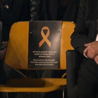 A seat reserved for the hostages held by Hamas in Gaza is seen at Israel's Memorial Day ceremony at the Western Wall, in the Old City of Jerusalem, on April 29, 2025. (Screenshot)