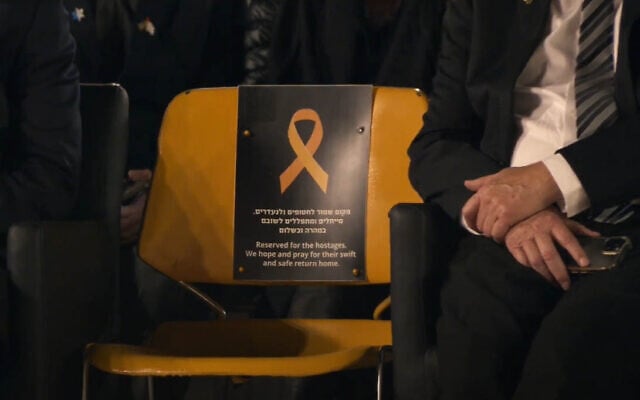 A seat reserved for the hostages held by Hamas in Gaza is seen at Israel's Memorial Day ceremony at the Western Wall, in the Old City of Jerusalem, on April 29, 2025. (Screenshot)