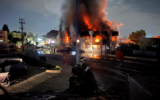 This photo taken from an IDF tank on October 7, 2023, shows the burning Sderot police station after it was attacked by Hamas terrorists. (Israel Defense Forces)
