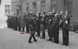 German troops arrest the last remaining members of the Warsaw Ghetto Uprising in this photo from the Stroop Report. A red line appears under Michael Smuss, with his father to his right. (National Archives Collection of World War II War Crimes Records)