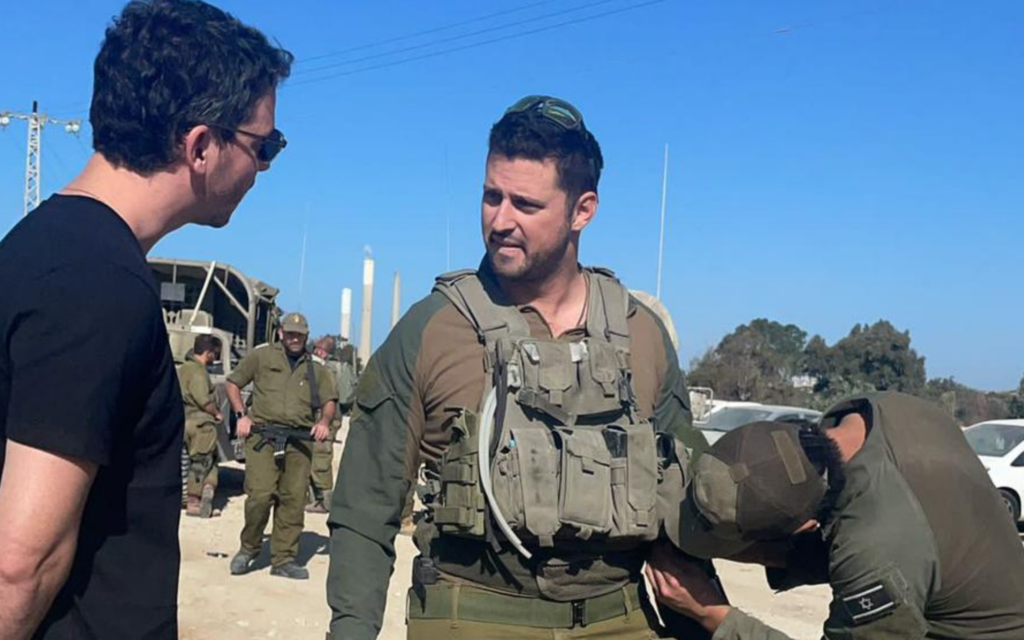 By chance, reserve combat paramedic David Citron (middle) runs into decade-long friend Alan Buch, a New York-based venture capitalist, at the Zikim crossing bordering the Gaza Strip, in December 2023. (Courtesy) By chance, reserve combat paramedic David Citron (middle) runs into decade-long friend Alan Buch, a New York-based venture capitalist, at the Zikim crossing bordering the Gaza Strip, in December 2023. (Courtesy)