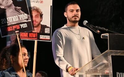 A handout photo shows freed captive Omer Wenkert addressing a rally at Hostages Square in Tel Aviv, April 5, 2025. (Paulina Patimer/Pro-Democracy Protest Movement)