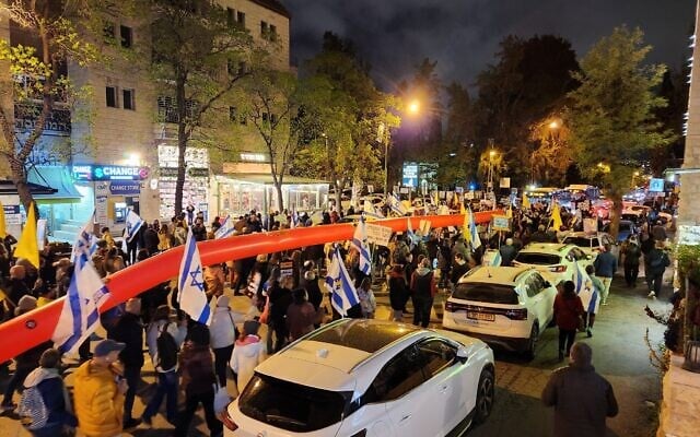 Protesters march toward the Jerusalem home of Strategic Affairs Minister Ron Dermer, head of Israel's negotiating team, demanding the government secure the release from Hamas captivity of all hostages, April 13, 2025. (Yair Palti, Pro-Democracy Protest Movement)
