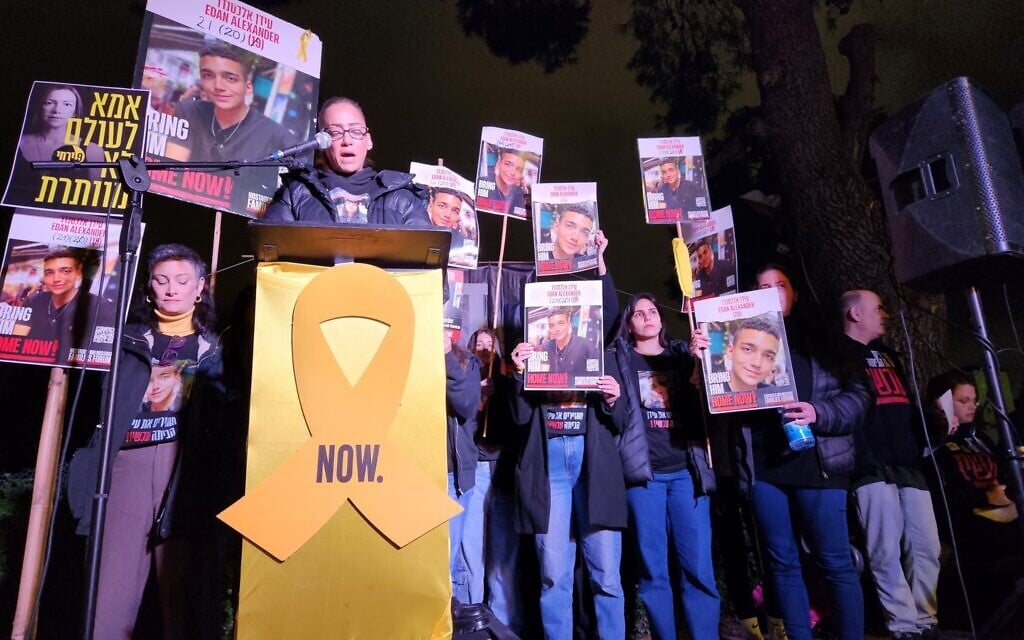 Iris Schwartz (foreground) and other relatives of Edan Alexander, who is held hostage by Hamas in Gaza, address protesters outside the Jerusalem home of Strategic Affairs Minister Ron Dermer, head of Israel's negotiating team, demanding the government secure the release from Hamas captivity of all hostages, April 13, 2025. (Yair Palti, Pro-Democracy Protest Movement)