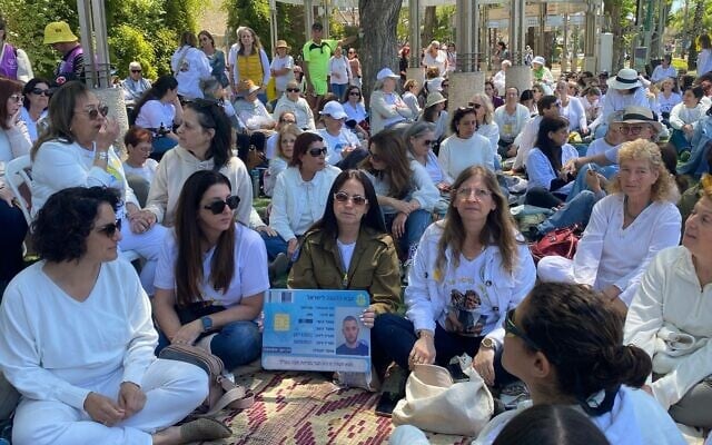 Anat Angrest, center, wearing her son Matan's IDF uniform, next to Idit Ohel, mother of hostage Alon Ohel, at a Shift 101 sit-in in Kiryat Bialik on April 15, 2025 (Shani Tamim/Shift 101)