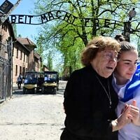 Holocaust survivor Irene Shashar, left, and released Gaza hostage Agam Berger at Auschwitz on April 23, 2025, a day before March of the Living. (Yossi Zeliger/March of the Living)