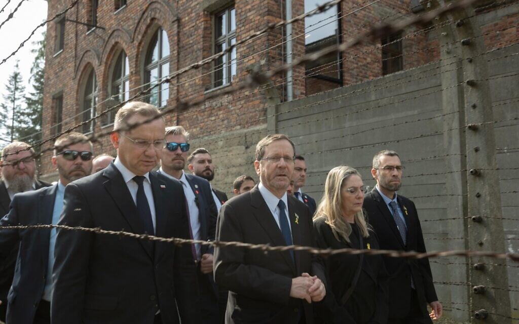 Polish President Andrzej Duda (left), President Isaac Herzog (center) and Michal Herzog arrive at Auschwitz on April 24, 2025, before the start of March of the Living. (Chen Schimmel/March of the Living)