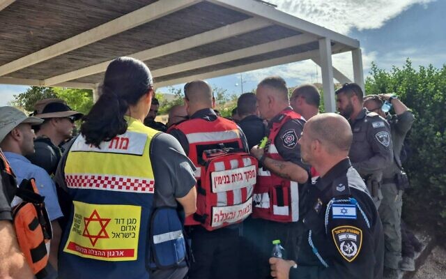 Paramedics and police at the scene of a fire that broke out in the Ein Prat Nature Reserve on April 27, 2025. (Magen David Adom) Paramedics and police at the scene of a fire that broke out in the Ein Prat Nature Reserve on April 27, 2025. (Magen David Adom)