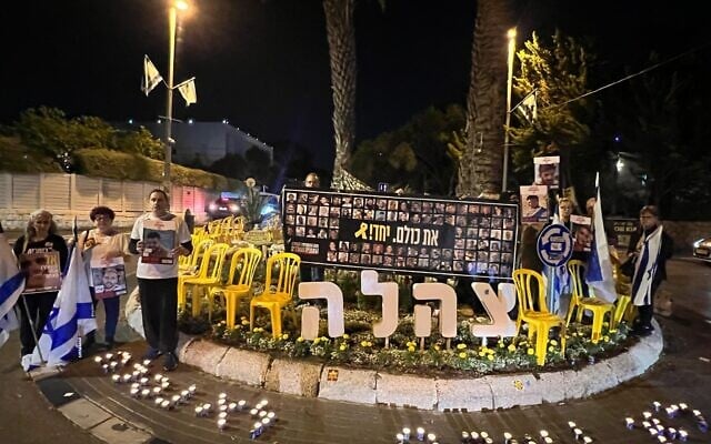 Protesters hold a silent demonstration near President Isaac Herzog's home in Tel Aviv, on the eve of Memorial Day, April 29, 2025. (Tal AM/Pro-Democracy Protest Movement)