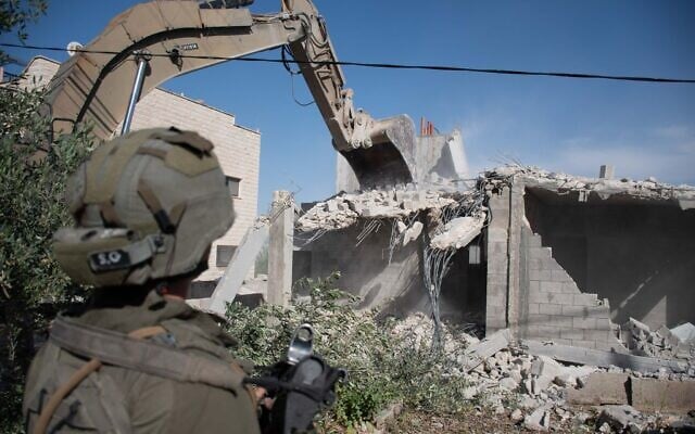 IDF troops demolish the home of a Hamas operative who killed a soldier in the West Bank town of Burqin, on April 16, 2025. (Israel Defense Forces)