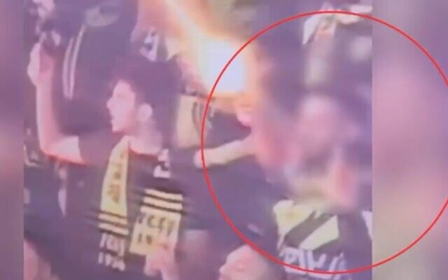 A Beitar Jerusalem fan shoots off a flare, injuring an eight-year-old boy at a soccer match between Beitar Jerusalem and Maccabi Haifa on April 28, 2025. (Screenshot/Israel Police)