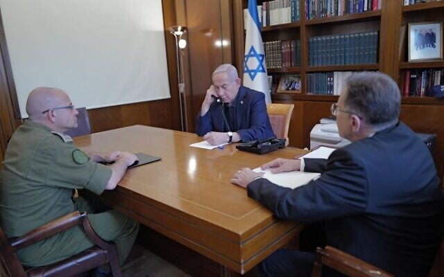 Prime Minister Benjamin Netanyahu sits with his Chief of Staff Tzachi Braverman and Military Secretary Maj. Gen. Roman Gofman as they discuss firefighting efforts, April 30, 2025 (Prime Minister's Office)