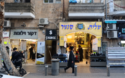 Shoppers in the Geula neighborhood of Jerusalem ahead of Passover, April 11, 2025 (Zev Stub/Times of Israel)