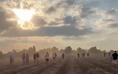 Partygoers flee the Nova festival near the Gaza border community of Re'im as Hamas terrorists approached on October 7, 2023. (South First Responders)