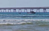 Police search for a diver who was attacked by a shark off the coast of Hadera, on April 21, 2025. (Israel Police)