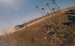 Hamas terror operatives open fire on an Israeli army vehicle near Beit Hanoun in the northern Gaza Strip, April 19, 2025, in footage released by the terror group. (Screenshot: Telegram)