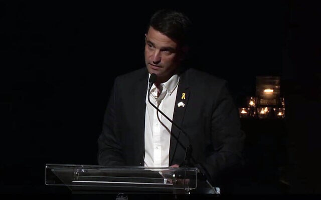 Hod Hasharon Mayor Amir Kochavi speaks at the city's ceremony for the onset of Holocaust Remembrance Day, April 23, 2025. (Screen capture via Facebook)