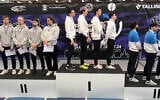 The Swiss under-23 fencing team (left) turn their backs during the playing of 'Hatikvah,' Israel's national anthem, after an Israeli victory in Tallinn, Estonia on April 26, 2025. (Screen capture via Ynet)