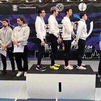 The Swiss under-23 fencing team (left) turn their backs during the playing of 'Hatikvah,' Israel's national anthem, after an Israeli victory in Tallinn, Estonia on April 26, 2025. (Screen capture via Ynet)