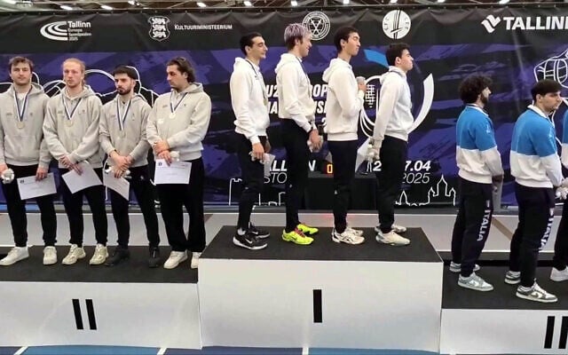The Swiss under-23 fencing team (left) turn their backs during the playing of 'Hatikvah,' Israel's national anthem, after an Israeli victory in Tallinn, Estonia on April 26, 2025. (Screen capture via Ynet)