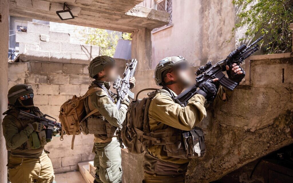 Troops kill Palestinian, injure 2 others who threw explosives at force in West Bank