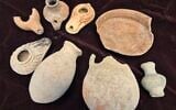 Looted artifacts seized at the house of a Dimona resident suspected of illegal antiquities trafficking on April 21, 2025. (Yoli Schwartz/Israel Antiquities Authority)