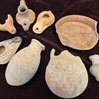 Looted artifacts seized at the house of a Dimona resident suspected of illegal antiquities trafficking on April 21, 2025. (Yoli Schwartz/Israel Antiquities Authority)