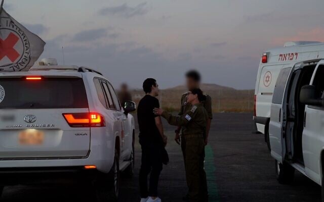 Released hostage soldier Staff Sgt. Edan Alexander, left, meets with IDF troops in the Gaza Strip, May 12, 2025. (Israel Defense Forces)