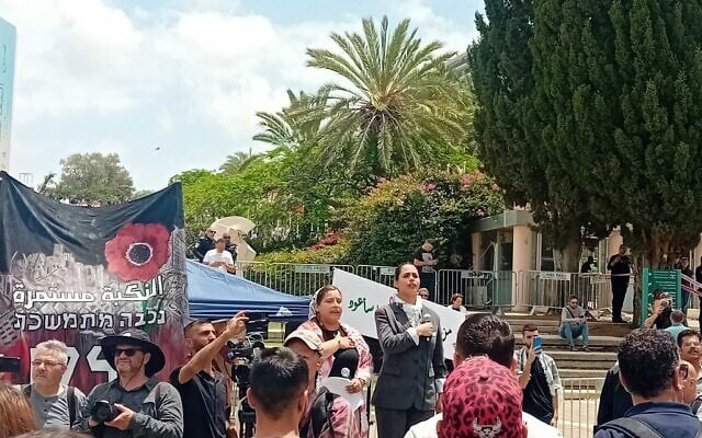 Protesters sing a patriotic Palestinian song during a Nakba memorial ceremony outside Tel Aviv University, May 15, 2025. (Noam Lehmann/The Times of Israel)