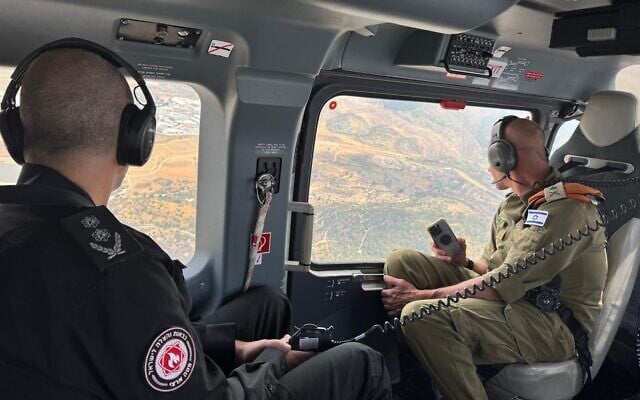 Fire and Rescue Services chief Eyal Caspi (left) and Home Front Command chief Maj. Gen. Rafi Milo assess the fires outside Jerusalem via helicopter, May 1, 2025. (IDF) Fire and Rescue Services chief Eyal Caspi (left) and Home Front Command chief Maj. Gen. Rafi Milo assess the fires outside Jerusalem via helicopter, May 1, 2025. (IDF)