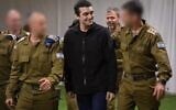 Released hostage soldier Staff Sgt. Edan Alexander, center, arrives at an IDF base near Re'im, May 12, 2025. (Israel Defense Forces)