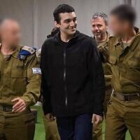 Released hostage soldier Staff Sgt. Edan Alexander, center, arrives at an IDF base near Re'im, May 12, 2025. (Israel Defense Forces)