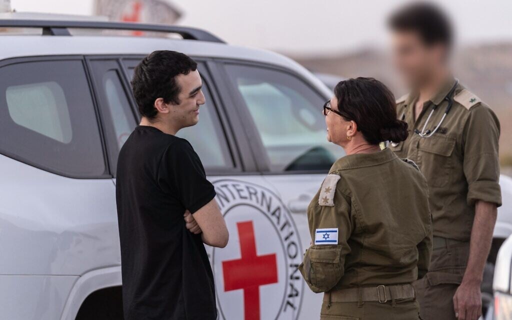 Released hostage soldier Staff Sgt. Edan Alexander, left, meets with IDF troops in the Gaza Strip, May 12, 2025. (Israel Defense Forces)