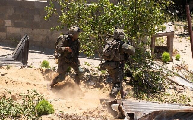 IDF troops operate in the Gaza Strip, in an image released on May 24, 2025. (Israel Defense Forces)