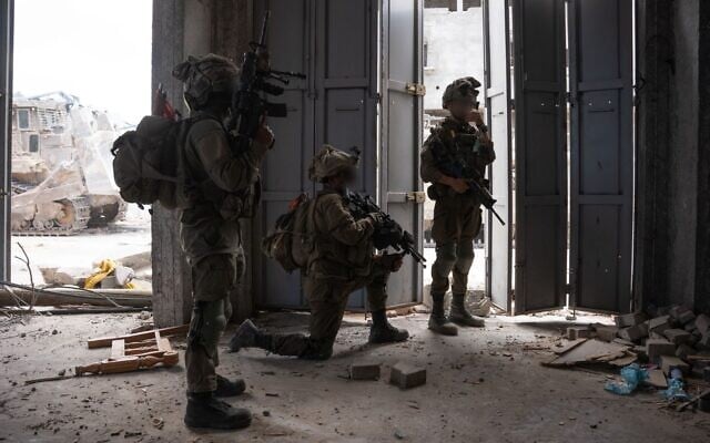 IDF troops operate in the Gaza Strip, in a handout photo issued by the military on May 19, 2025. (Israel Defense Forces) IDF troops operate in the Gaza Strip, in a handout photo issued by the military on May 19, 2025. (Israel Defense Forces)