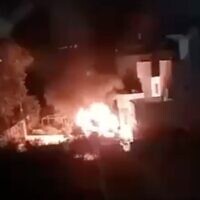 A screenshot from social media shows a fire during a reported settler attack on the West Bank village of Bruqin, early May 22, 2025. (X screenshot)