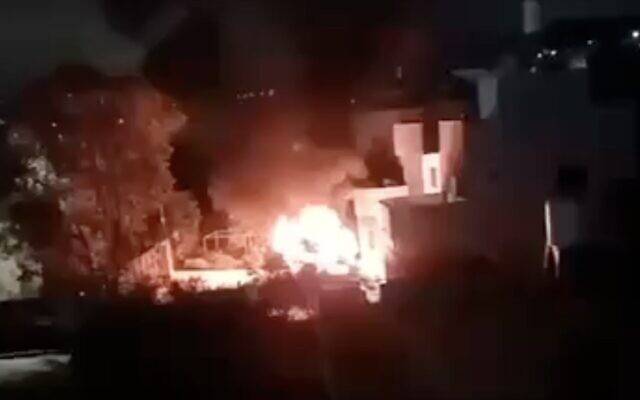 A screenshot from social media shows a fire during a reported settler attack on the West Bank village of Bruqin, early May 22, 2025. (X screenshot)