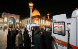 Emergency personnel transport the injured following a shooting attack at Iran's Shah Cheragh mausoleum in the Fars province capital Shiraz, on August 13, 2023. (MOHAMMADREZA DEHDARI / ISNA / AFP)