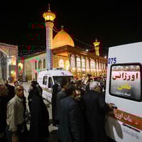 Emergency personnel transport the injured following a shooting attack at Iran's Shah Cheragh mausoleum in the Fars province capital Shiraz, on August 13, 2023. (MOHAMMADREZA DEHDARI / ISNA / AFP)