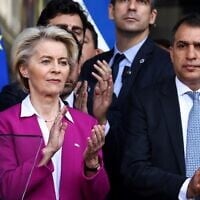 European Commission President Ursula Von der Leyen (left) and Israeli Ambassador to the EU and NATO Haim Regev (right) take part in a tribute to the victims of the October 7 attack, at the European Parliament in Brussels, October 11, 2023. (Kenzo TRIBOUILLARD / AFP)