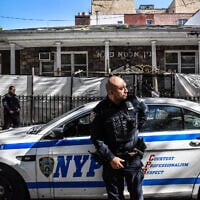 Members of the New York Police Department patrol in front of a synagogue on October 13, 2023 in the Williamsburg neighborhood in the borough of Brooklyn in New York City. (Stephanie Keith/Getty Images via AFP)
