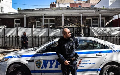 Members of the New York Police Department patrol in front of a synagogue on October 13, 2023 in the Williamsburg neighborhood in the borough of Brooklyn in New York City. (Stephanie Keith/Getty Images via AFP)